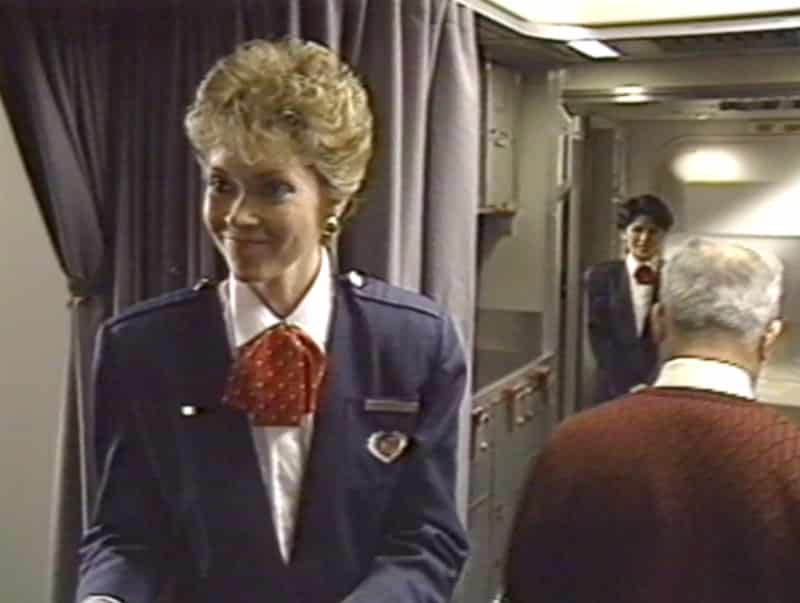 Flight Attendant welcome passengers boarding a Canadian Airlines International Boeing 747-400