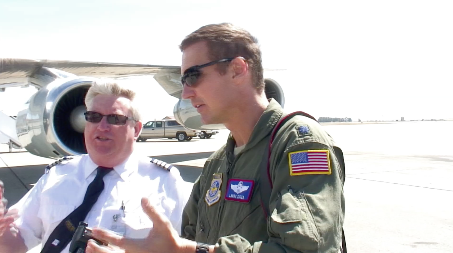 ATI DC-8-62 Captain Brad Watts talks with USAF Lt. Col. Larry Suter about the air conditioning system of the ATI DC-8-62 N799AL on the ramp at Travis AFB on May 12, 2013. This is a screenshot from the 9 episode mini series "DC-8 Farewell" that streams on the JetFlix TV streaming service for aviation super fans.