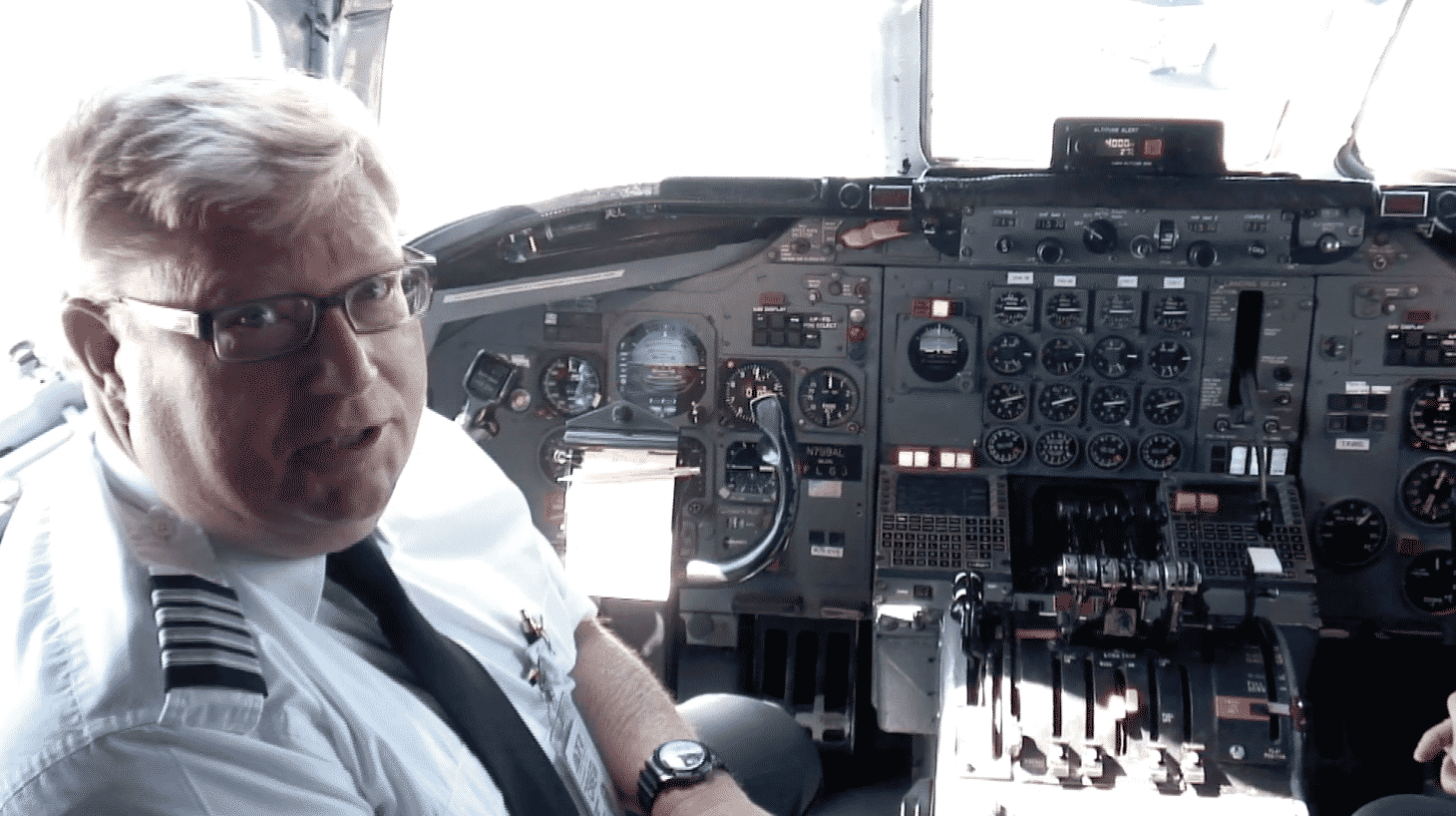 ATI DC-8-62 Captain Brad Watts talks with USAF Lt. Col. Larry on the flight deck of the ATI DC-8-62 N799AL at Travis AFB on May 12, 2013. This is a screenshot from the 9 episode mini series "DC-8 Farewell" that streams on the JetFlix TV streaming service for aviation super fans.