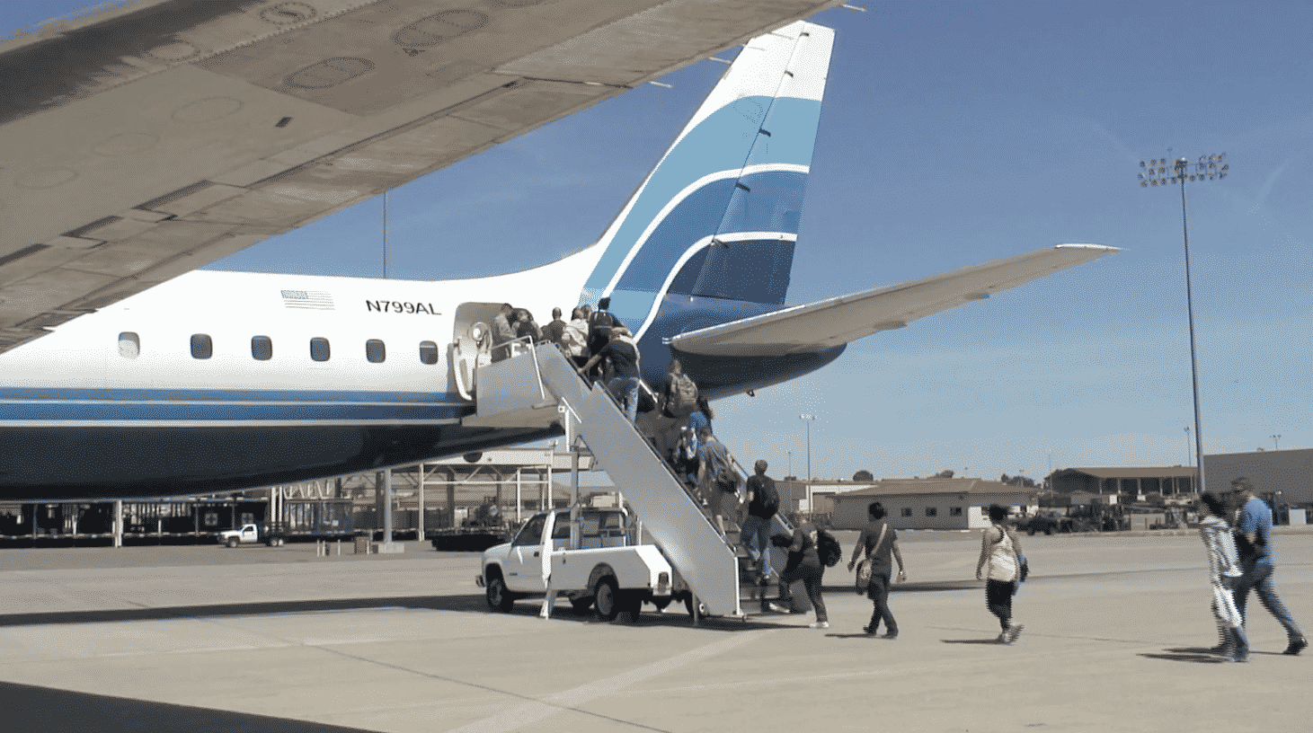 Military personnel passengers board ATI DC-8-62 N799AL for the last time ever (before the classic jetliner was retired) at Travis AFB on May 12, 2013. This is a screenshot from the 9 episode mini series "DC-8 Farewell" that streams on the JetFlix TV streaming service for aviation super fans.