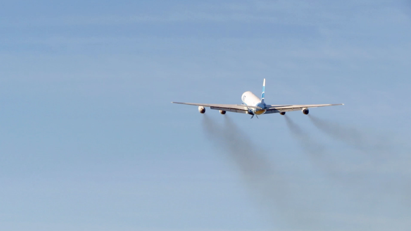 ATI DC-8-62 N799AL leaves a trail of smoke on its final flight within the Continental United States having departed from McClellan Airport on May 12, 2013, bound for Travis AFB. This is a screenshot from the 9 episode mini series "DC-8 Farewell" that streams on the JetFlix TV streaming service for aviation super fans.