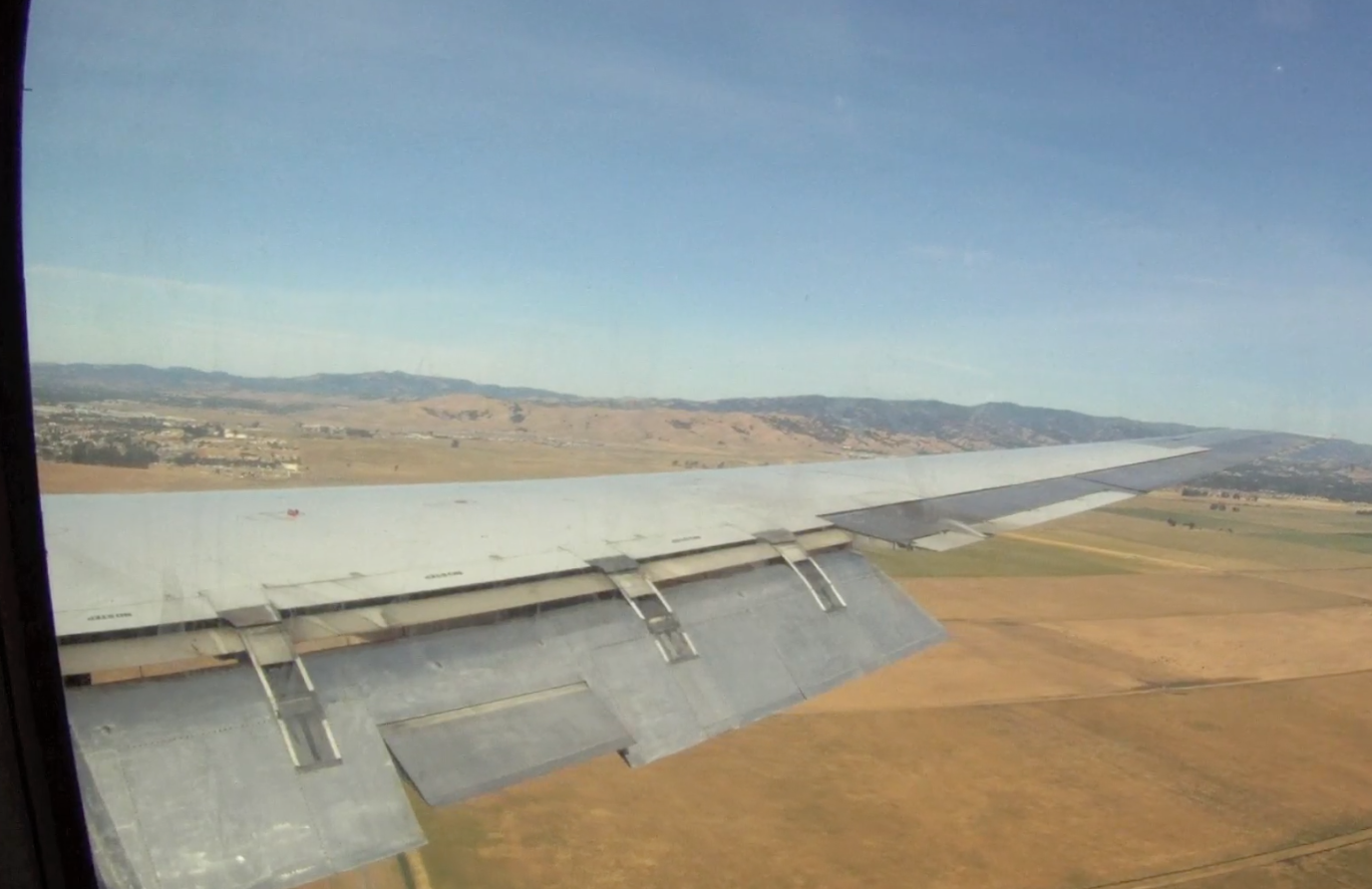 ATI DC-8-62 N799AL flaps set to landing on approach to Travis AFB inbound from McClellan Airport on May 12, 2013. This is a screenshot from the 9 episode mini series "DC-8 Farewell" that streams on the JetFlix TV streaming service for aviation super fans.