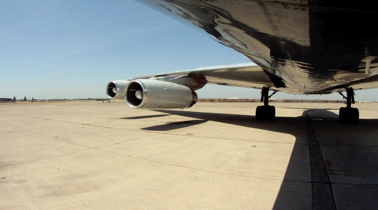 Exterior engine view of ATI DC-8-62 N799AL at McClellan Airport on May 10, 2013, during live taxi and max power engine check on two of the JT3 engines. We had 2 video cameras mounted on the exterior of the aircraft. JetFlix TV's Henry Tenby filmed the entire event using multiple video camera on the flight deck, exterior of the aircraft and in the cabin viewing the wings and engines. The check was performed by ATI maintenance and engineers Robert Dobler and Phil Sisco. Two days later this aircraft was filmed on its flight to Travis AFB. This is a screenshot from the 9 episode mini series "DC-8 Farewell" that streams on the JetFlix TV streaming service for aviation super fans.