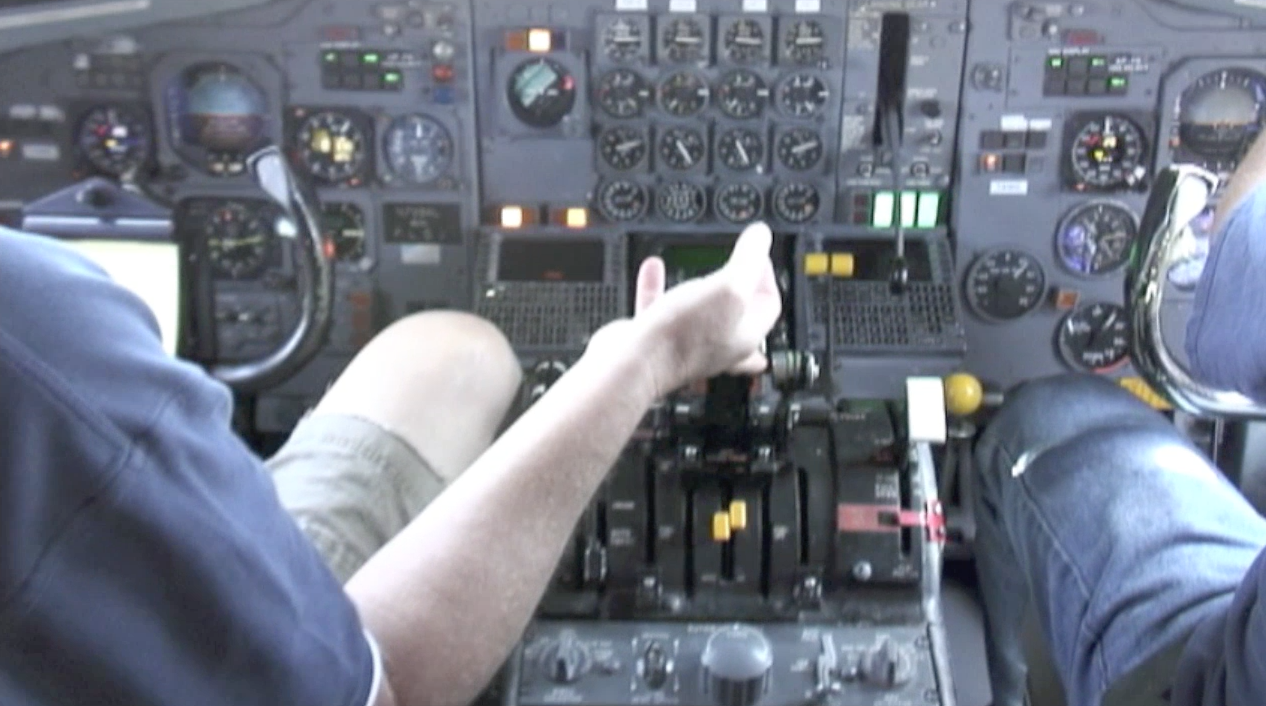 ATI maintenance engineer Robert Dobler advances the throttles to max power on board ATI DC-8-62 N799AL at McClellan Airport on May 10, 2013, during live taxi and max power engine check on two of the JT3 engines. JetFlix TV's Henry Tenby filmed the entire event using multiple video camera on the flight deck, exterior of the aircraft and in the cabin viewing the wings and engines. The check was performed by ATI maintenance and engineers Robert Dobler and Phil Sisco. Two days later this aircraft was filmed on its flight to Travis AFB. This is a screenshot from the 9 episode mini series "DC-8 Farewell" that streams on the JetFlix TV streaming service for aviation super fans.