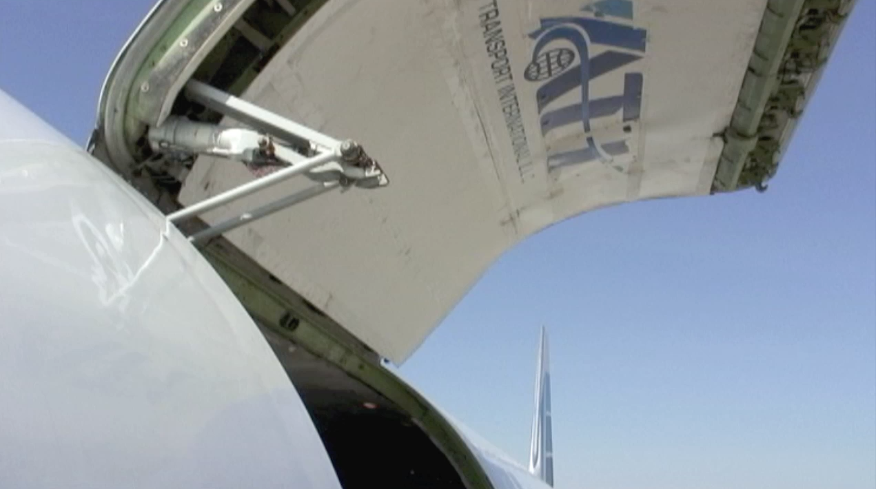 Open main deck cargo door of ATI DC-8-62 N799AL at McClellan Airport on May 10, 2013, in preparation for taxi and engine tests. This is a screenshot from the 9 episode mini series "DC-8 Farewell" that streams on the JetFlix TV streaming service for aviation super fans.