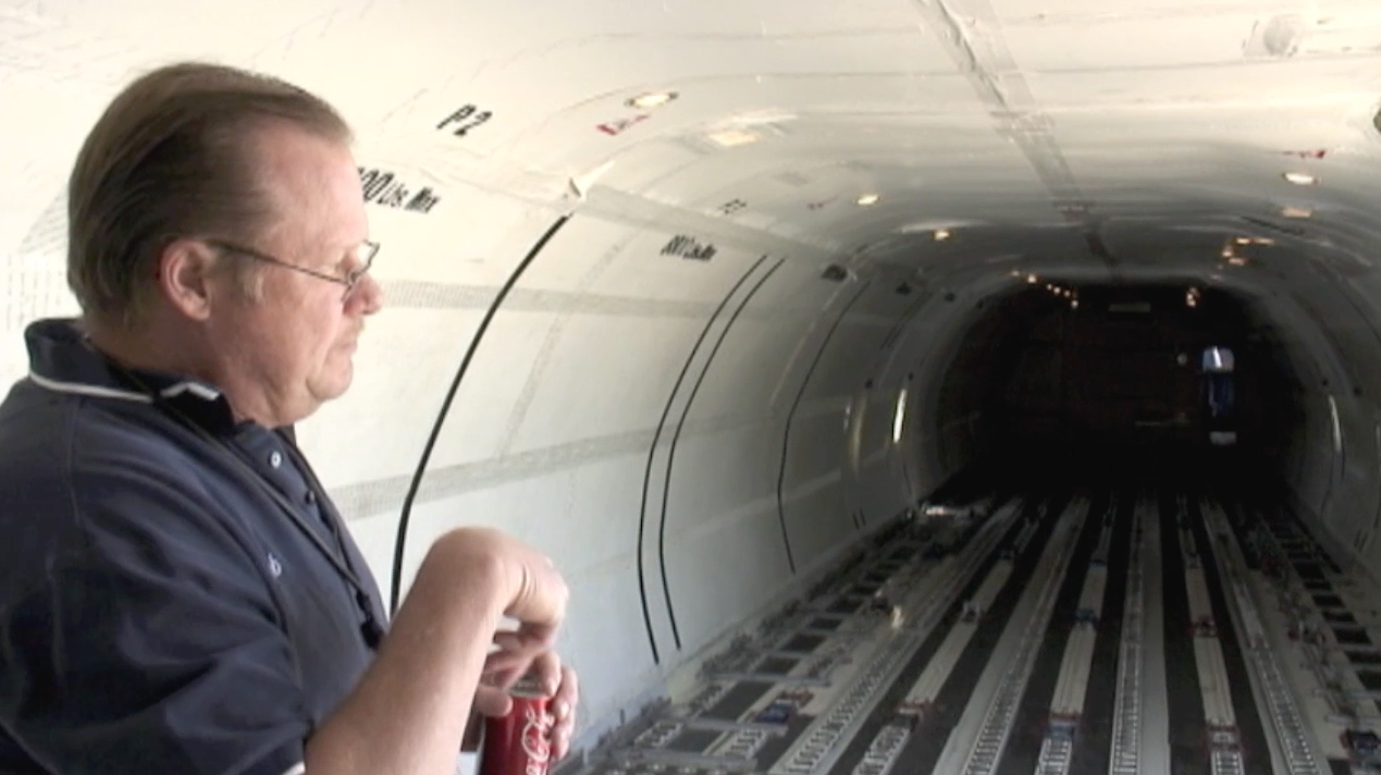 ATI maintenance engineer Robert Dobler showing the main deck cargo hold during a very detailed aircraft and systems tour of ATI DC-8-62 N799AL at McClellan Airport on May 10, 2013, prior to taxi and engine tests done that same day. This is a screenshot from the 9 episode mini series "DC-8 Farewell" that streams on the JetFlix TV streaming service for aviation super fans.