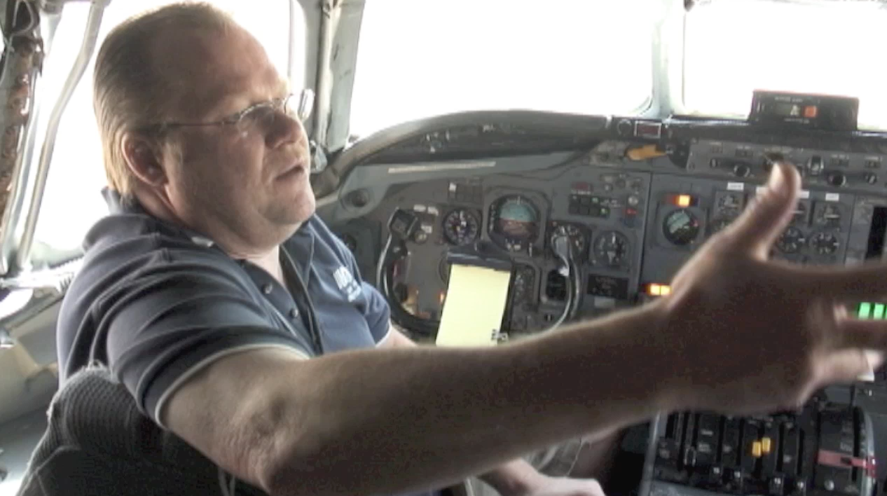 ATI maintenance engineer Robert Dobler explaining the flaps and spoilers systems test from the flight deck of ATI DC-8-62 N799AL at McClellan Airport on May 10, 2013. This is a screenshot from the 9 episode mini series "DC-8 Farewell" that streams on the JetFlix TV streaming service for aviation super fans.